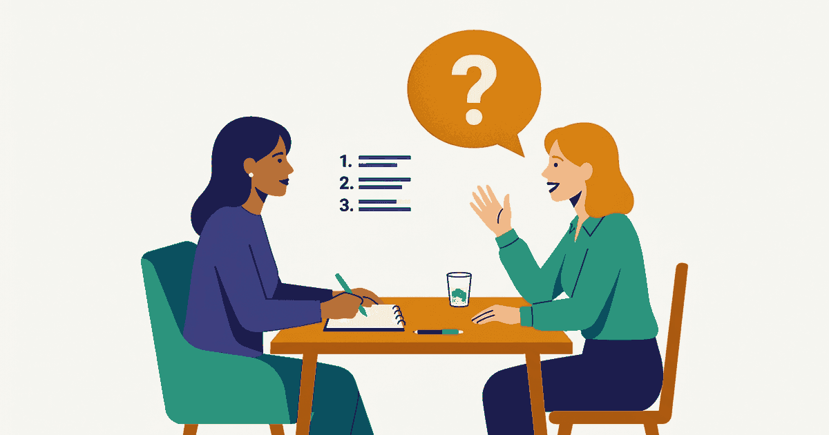 A candidate asking a question across an interview table, with a short list of three questions beside them