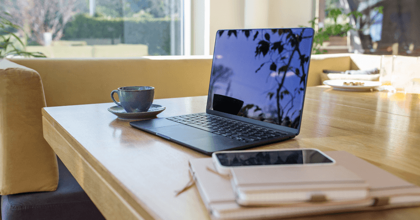 Remote work setup with laptop and notebook